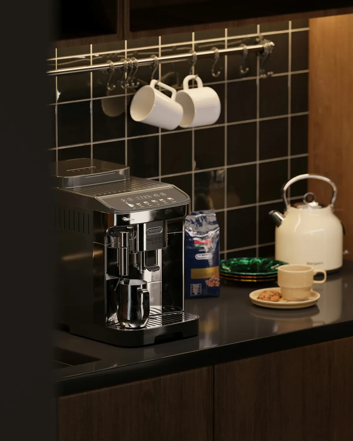 Coffee machine on a black counter with white mugs hanging from a metal rail on a black tile wall and a cream kettle